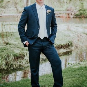 Two men’s suits.